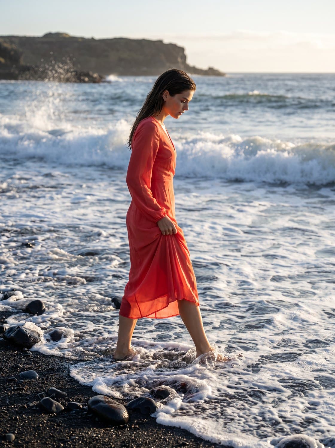 The same character wading through shallow water on a black volcanic shore